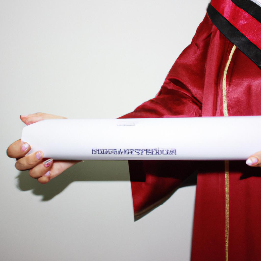 Person holding a graduation diploma