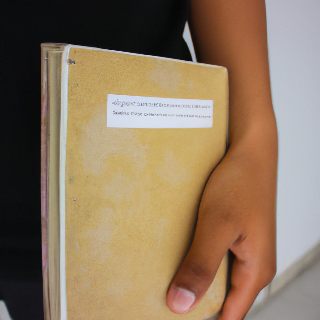 Person holding a school book